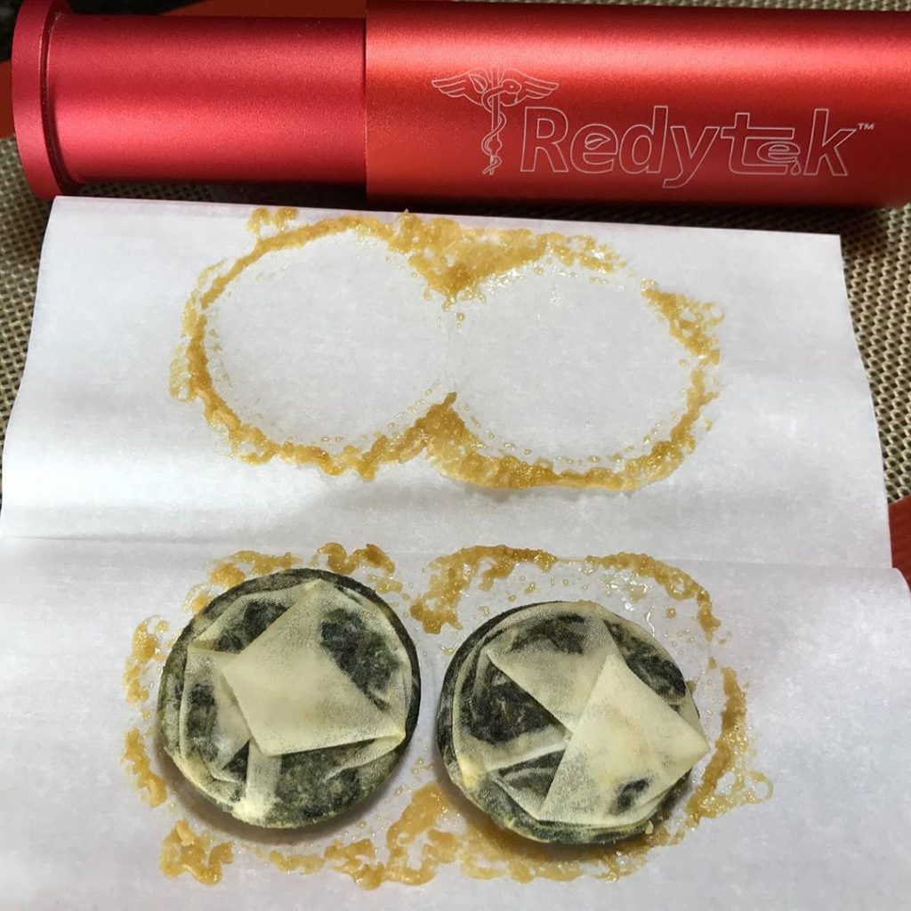 Turning Crescent City Dispensary flower into gold solventless concentrate using Rosin technique and Redytek rosin press California