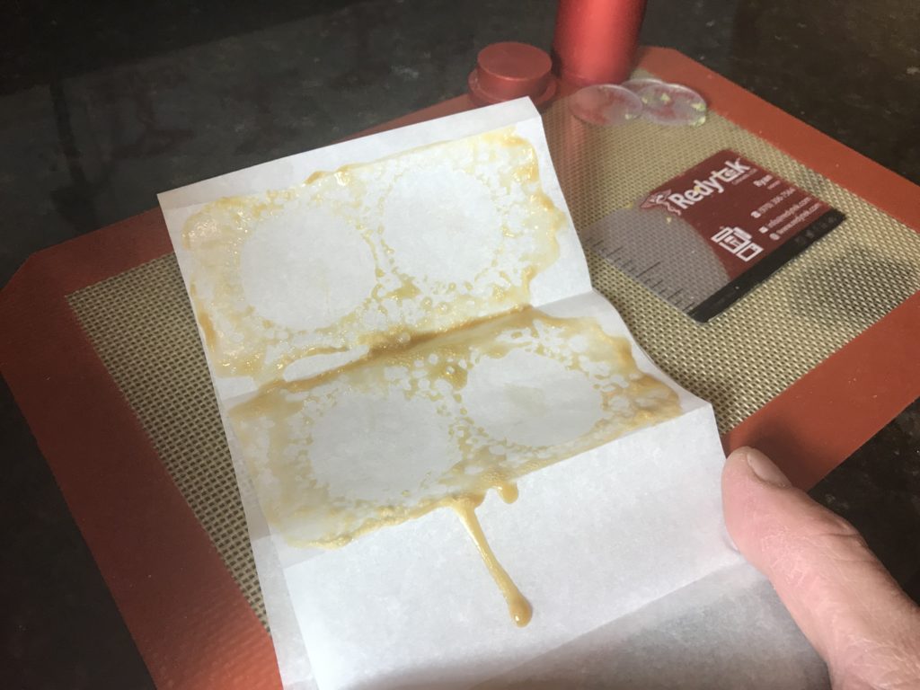 Turning Warwick Dispensary flower into gold solventless concentrate using Rosin technique and Redytek rosin press Rhode Island