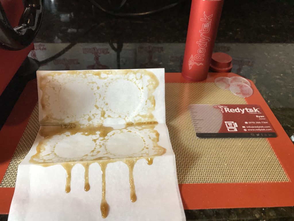 Turning South Bend Dispensary flower into gold solventless concentrate using Rosin technique and Redytek rosin press Washington