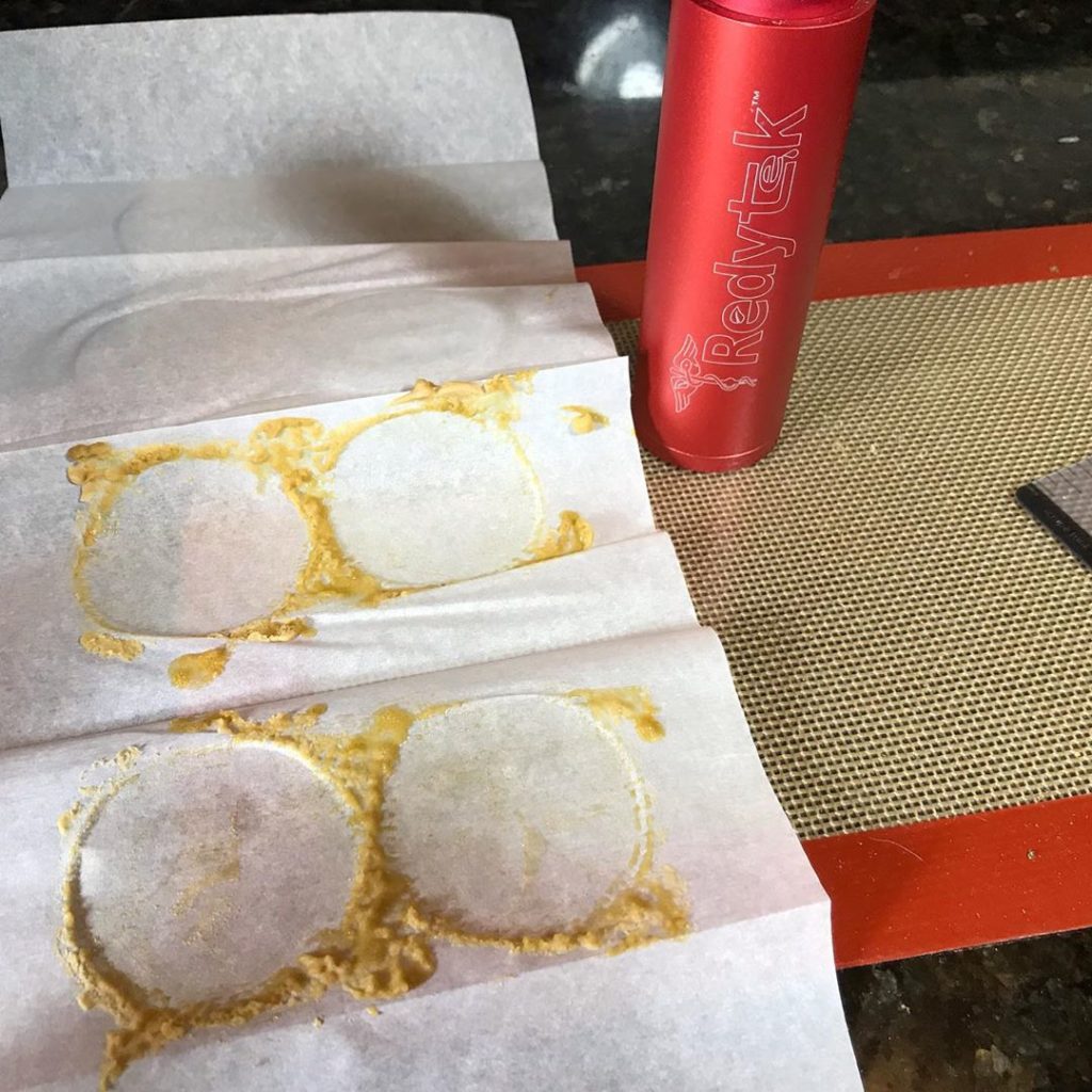 Turning Beaverton Dispensary flower into gold solventless concentrate using Rosin technique and Redytek rosin press Michigan